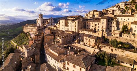 impressive medieval assisi town in umbria over sunset italy aerial drone panoramic view