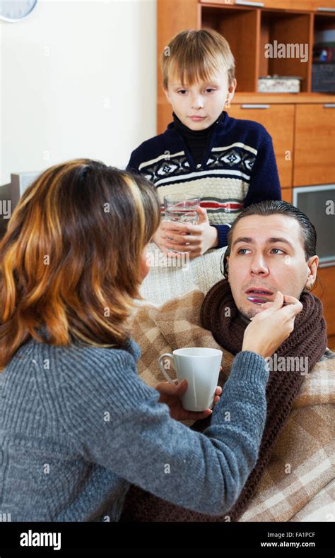 Wife Caring For Sick Husband At Home Hi Res Stock Photography And