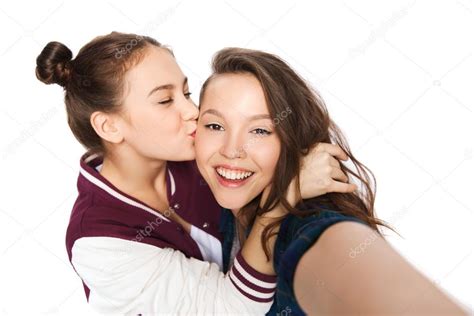 Happy Teenage Girls Taking Selfie And Kissing Stock Photo By ©syda