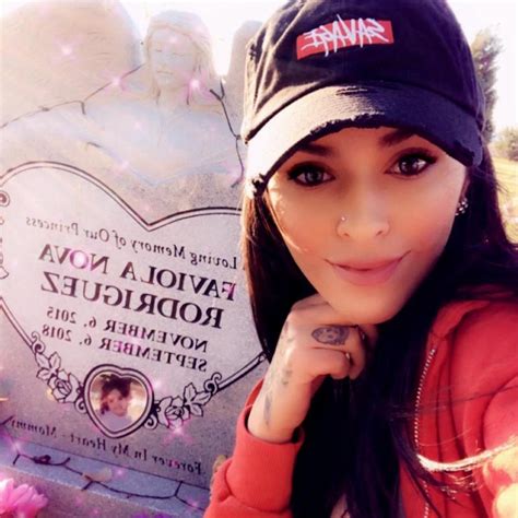 mom captured the spirit of her dead daughter playing with her toys at her own grave