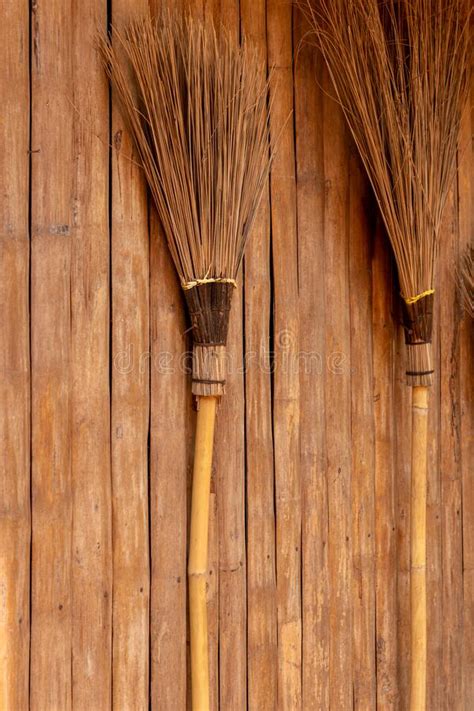 The Broom Is Leaning Against A Wooden Wall Stock Image Image Of
