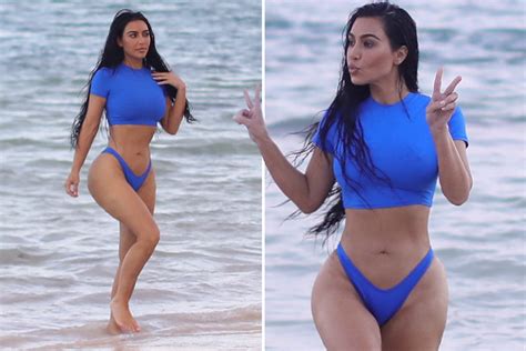kim kardashian shows off killer curves in blue bikini on the beach during sexy skims photoshoot