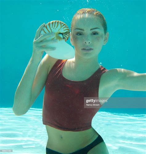 Young Girl Underwater With Shell And Makeup Photo Getty Images