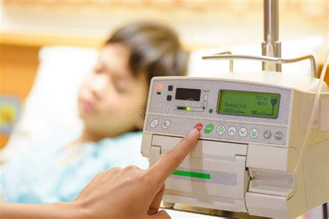 Nurse S Hand Pressing On Infusion Pump Intravenous Iv Drip Stock Photo