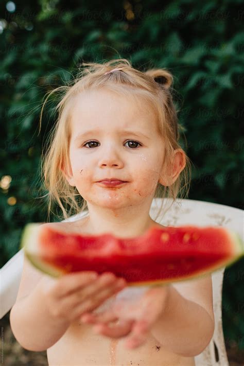 Cute Babe Girl Eating Watermelon Outside In The Summer By Stocksy Contributor Jessica