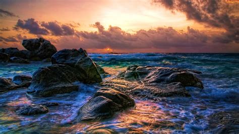 Stones Rocks On Beach Waves During Sunset Under White Clouds Sky 4k