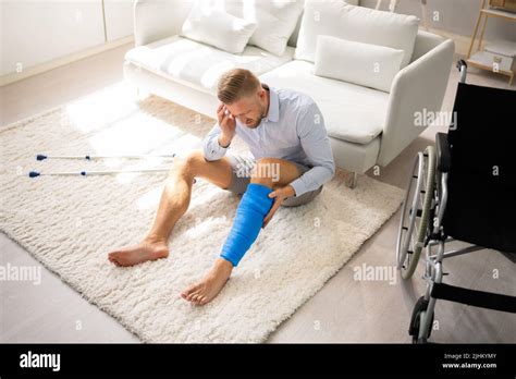Man With Broken Leg Cast And Crutches Stock Photo Alamy