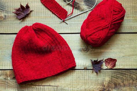 Red Knitting Wool Knitting Needles And Dried Leaves Stock Image