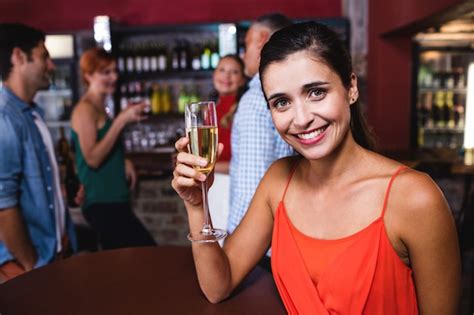 Premium Photo Woman Enjoying Champagne In Night Club