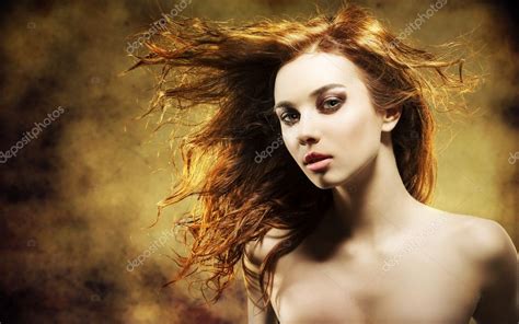 Sexy Woman With Flying Hair On Grunge Background Stock Photo