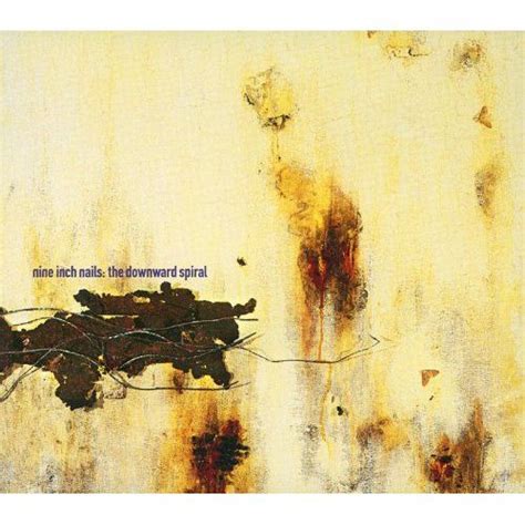 A Rusted Wall With The Words Nine Inch Nails The Downward Spiral