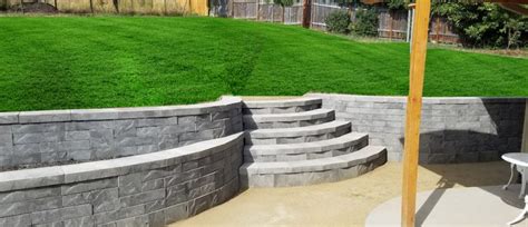 Use rubber mallet to tap bricks level after using a thin mixture of 3/4 sand and 1/4 cement in bottom of channel. Concrete Block Retaining Walls | Masonry Retaining Wall