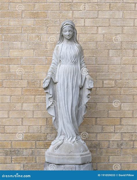 Statue Of The Blessed Virgin Mary Standing On A Snake Outside Of Christ