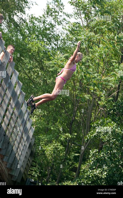 Girl In Polka Dot Bikini Jumping Off Bridge Stock Photo Alamy