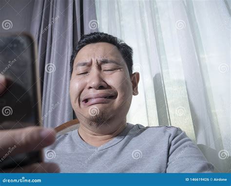 Young Man Crying To Get Bad News On Phone Stock Photo Image Of Facial