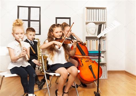 Cheerful Children Playing Musical Instruments Stock Photo By ©serrnovik