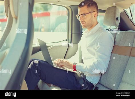 Concentrated Male Person Working In His Car Stock Photo Alamy