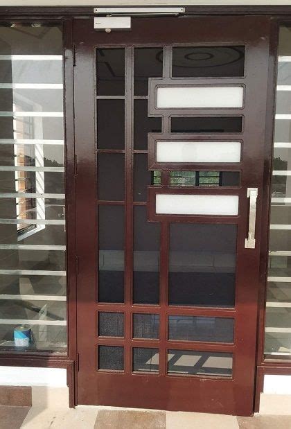 A Brown Door With Glass Panels On It