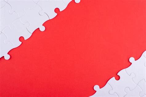 Premium Photo Flat Lay White Puzzle Pieces And Red Background