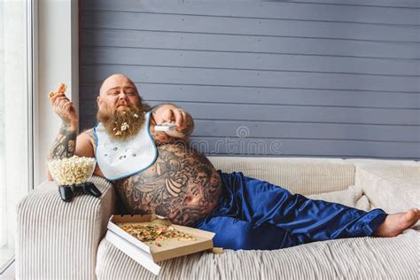 Relaxed Thick Guy Entertaining With Pizza And Television Stock Image Image Of Overweight