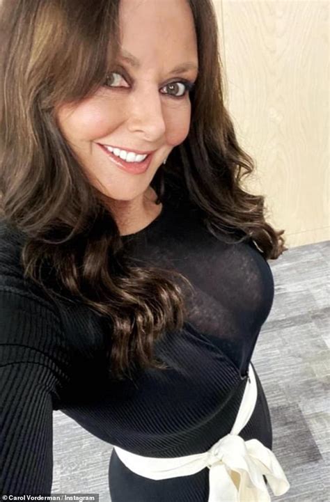 carol vorderman 60 puts on a very busty display in a semi sheer black top daily mail online