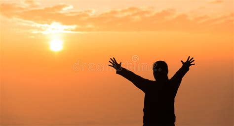 Silhouette Of Woman Raising Her Hand Praying Spirituality And Religion