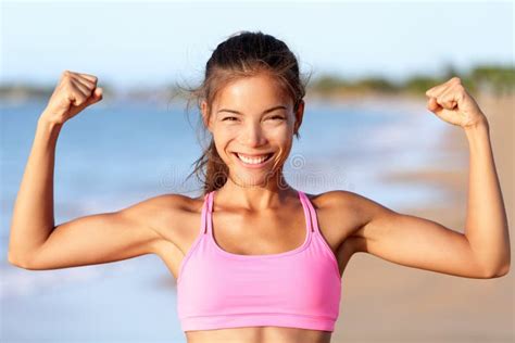 Happy Fitness Woman Flexing Muscles On Beach Stock Photo Image Of
