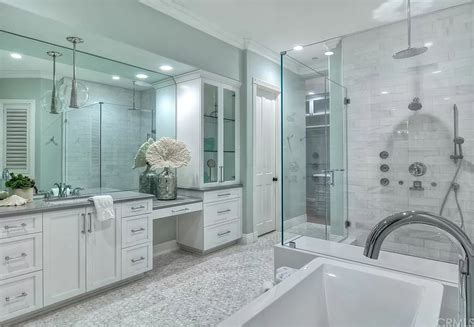 This bathroom has some great color ideas, matching the white of the tubs with the light baby blue walls to give the room a nice calm feel. Bathroom Ideas 2020 | Pictures Designs Colors