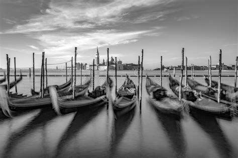 Blurred Gondolas At San Marco With View In Early Morning To Island San