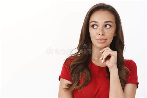 Close Up Thoughtful Attractive Feminine Brunette Female In Red T Shirt Touch Chin Look Left
