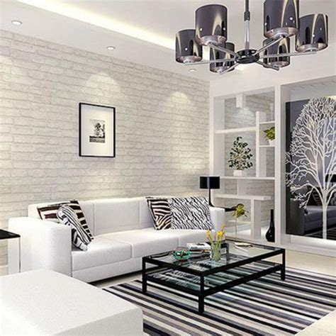 A Living Room With White Furniture And Black Accents