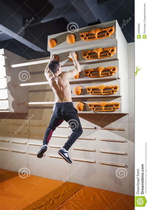 Young Man Practicing Rock Climbing In Climbing Gym Stock Photo Image Of Height Adult 53390982