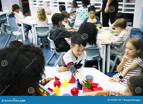 Group Of Diverse Students At Daycare Stock Photo Image Of Chairs