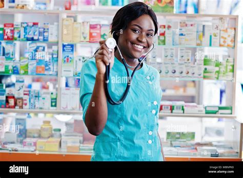 African American Pharmacist Working In Drugstore At Hospital Pharmacy