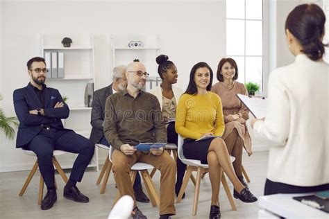 Female Business Coach In Meeting In Office Speaks In Front Of Small