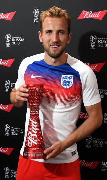 Harry Kane Of England Poses With His Man Of The Match Trophy During The