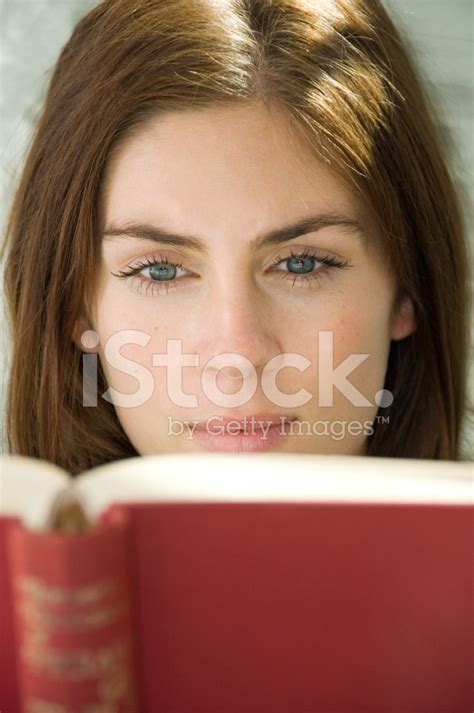 Cute Young Woman Reading A Book Stock Photo Royalty Free Freeimages