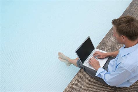 Working Poolside Stock Photos Pictures And Royalty Free Images Istock