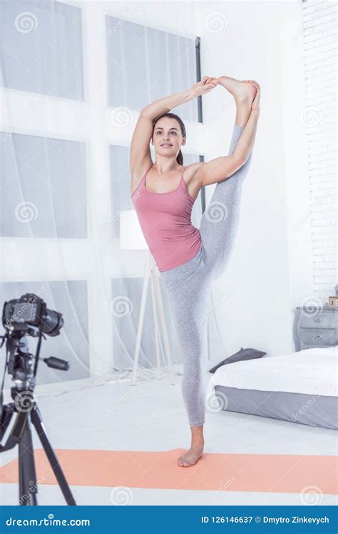 Delighted Nice Woman Holding Her Leg Up Stock Image Image Of Hobby