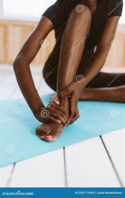 Unrecognizable Barefoot Dark Skin Multiracial Woman Touching Feet