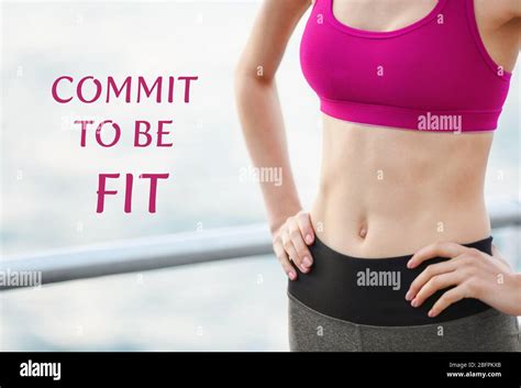 Fitness Quotes Text Commit To Be Fit On Background Young Woman In