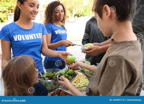volunteers serving food to poor people stock image image of poverty help 162999115