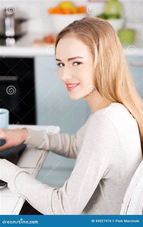 Young Woman Using A Laptop Computer At Home Stock Photo Image Of