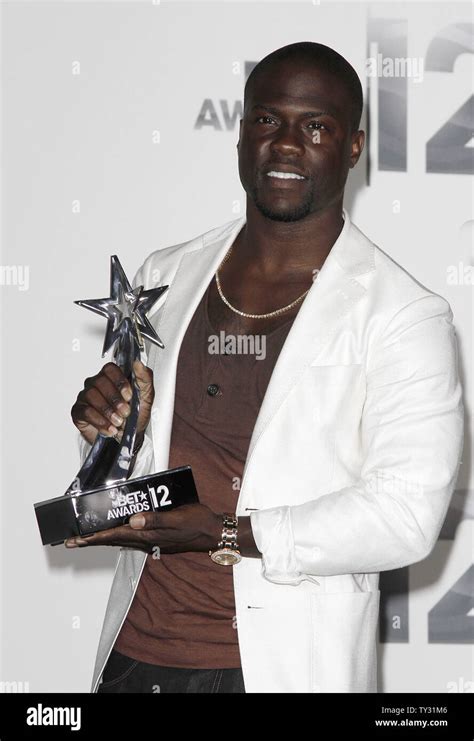 Actor Kevin Hart Appears Backstage With The Best Actor Award He Won