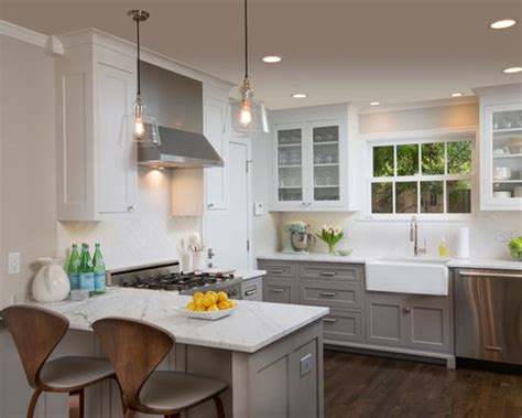 Don't be afraid to play with placement—no one said the ceiling is off limits! Dark Lower White Upper Cabinets | Houzz