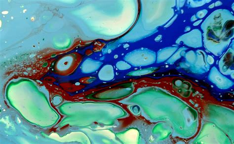 An Abstract Painting With Blue Green And Red Colors