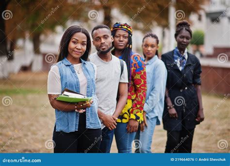 Row Of Group Five African College Students Spending Time Together On