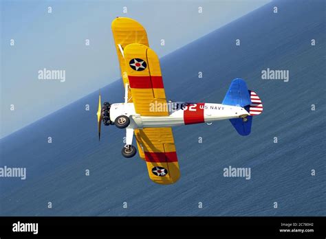 A Restored 1940s Us Navy Boeing Stearman N2s Biplane Trainer Banking