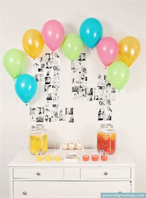 A Table Topped With Lots Of Balloons Next To A White Dresser Covered In