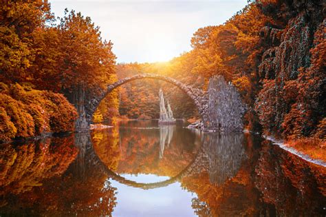 Rakotz Bridge In Kromlau Saxony Germany Colorful Autumn Reflection Of